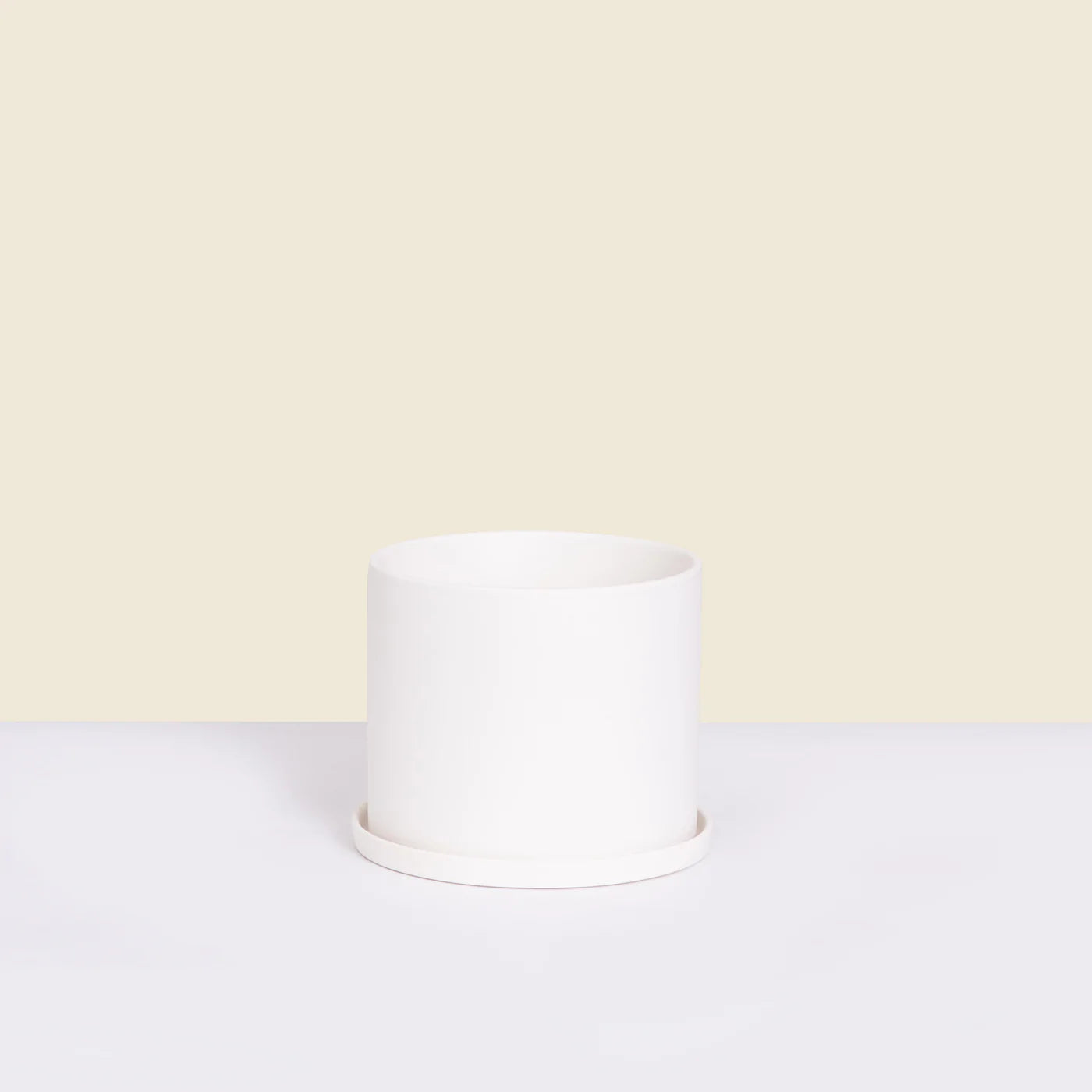
                  
                    White Pot with Saucer
                  
                